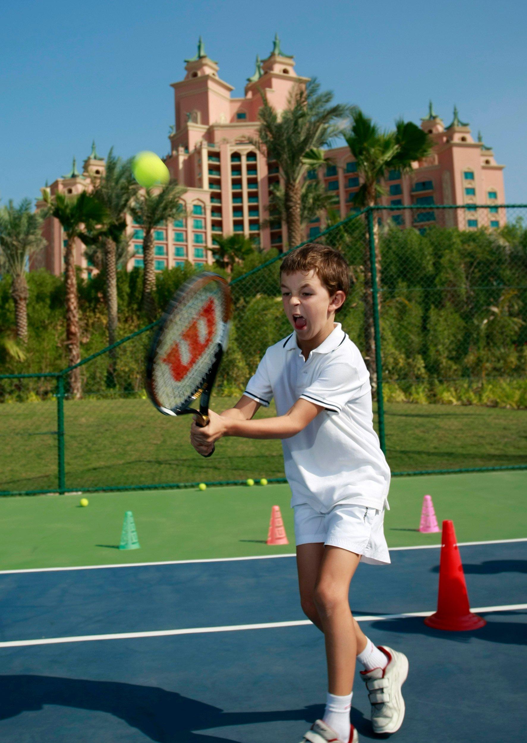 Kid playing Tennis